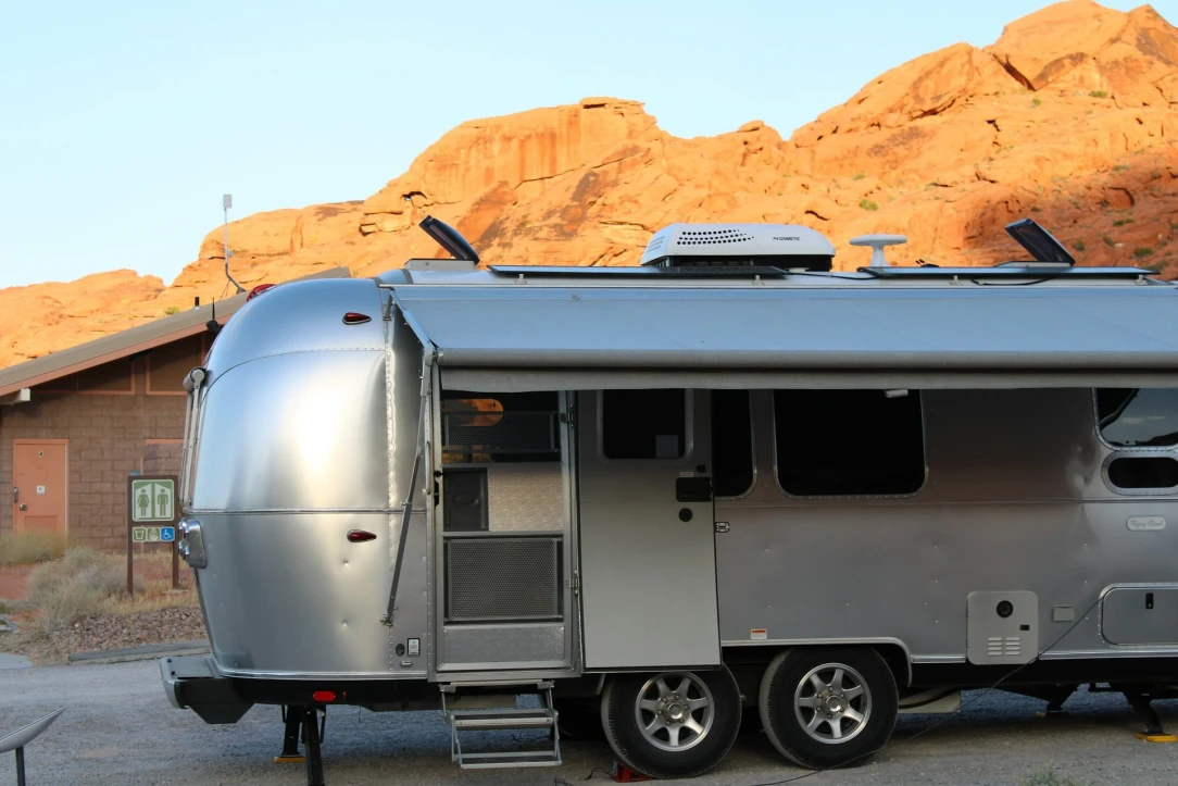 a travel trailer in the sand