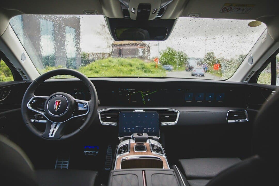 wide view of a modern car interior featuring a digital dashboard