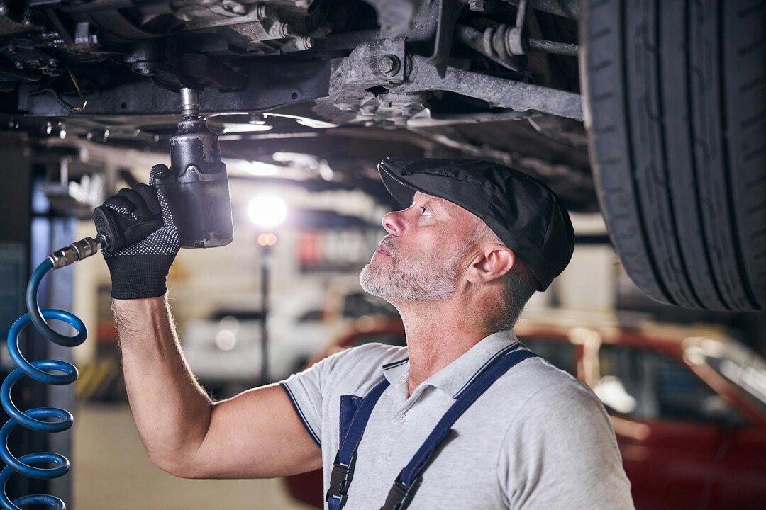 professional mechanic repairing a car