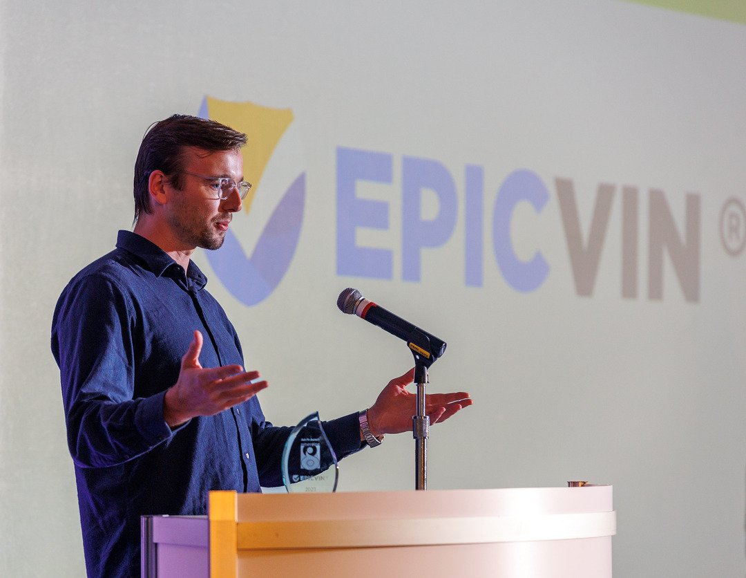 EpicVIN speaker at a podium during a presentation
