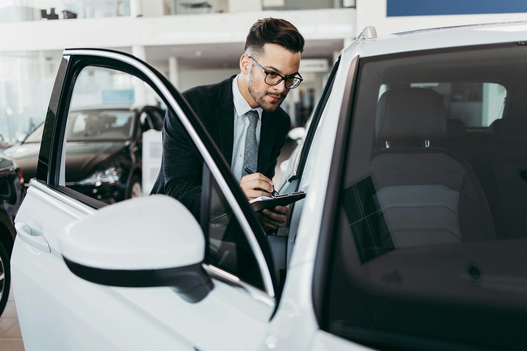experienced car dealer at work