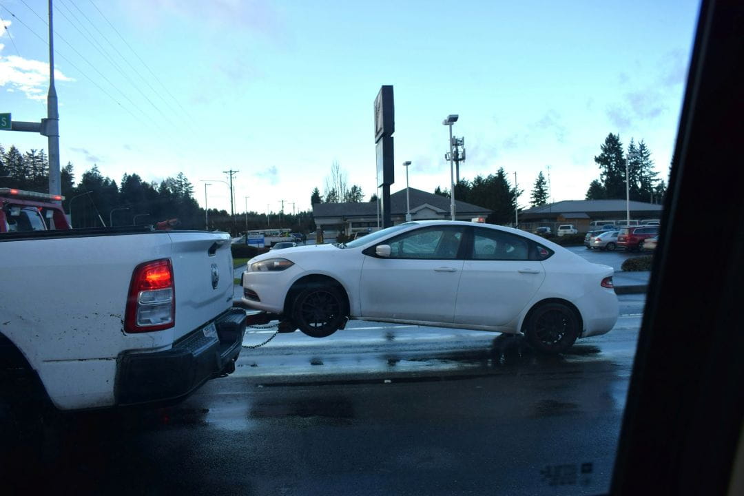 a car being towed to an impound lot