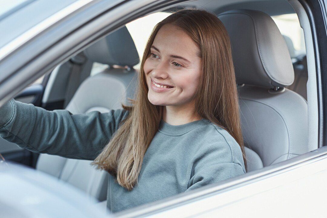 young woman driving a car