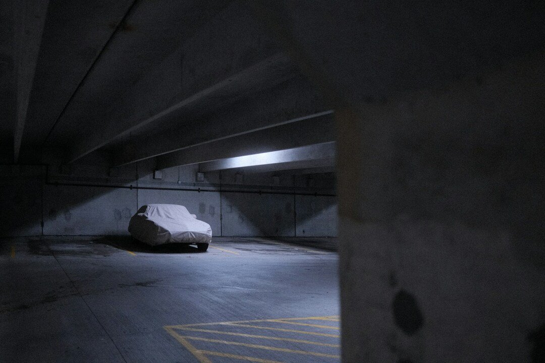 car in dark underground garage