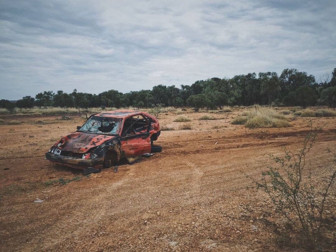 an abandoned car damaged in fire