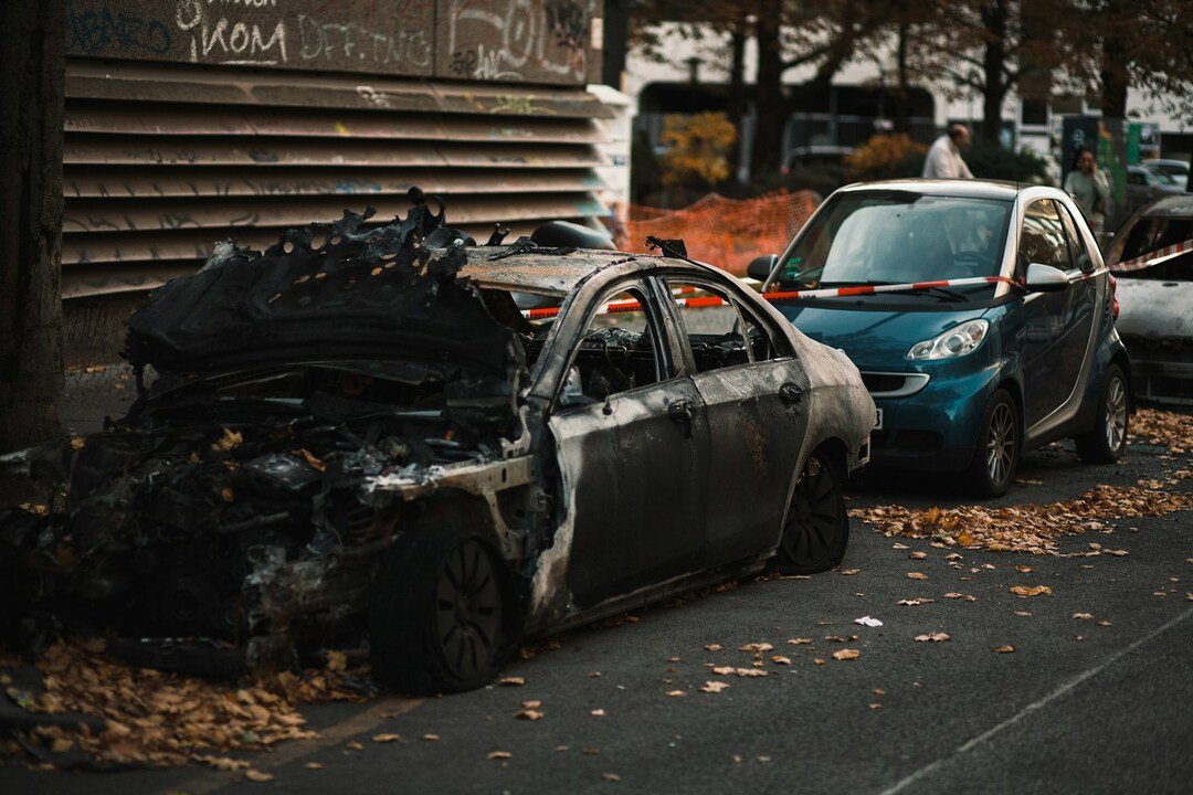 burnt and damaged cars on the street